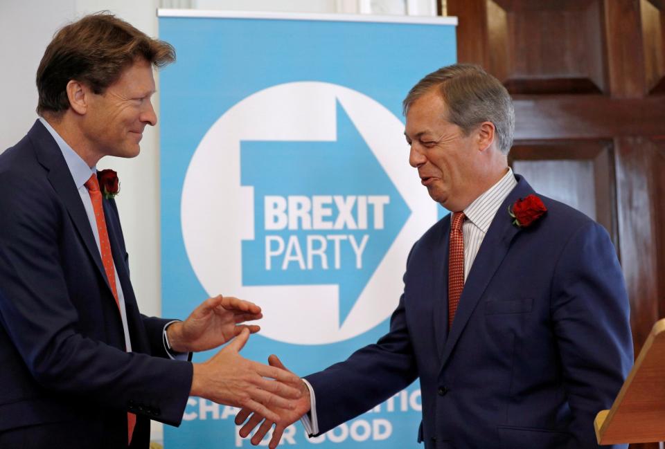 Richard Tice, left, greets Mr Farage at the Brexit Party press conference on Tuesday (Peter Nicholls/Reuters)