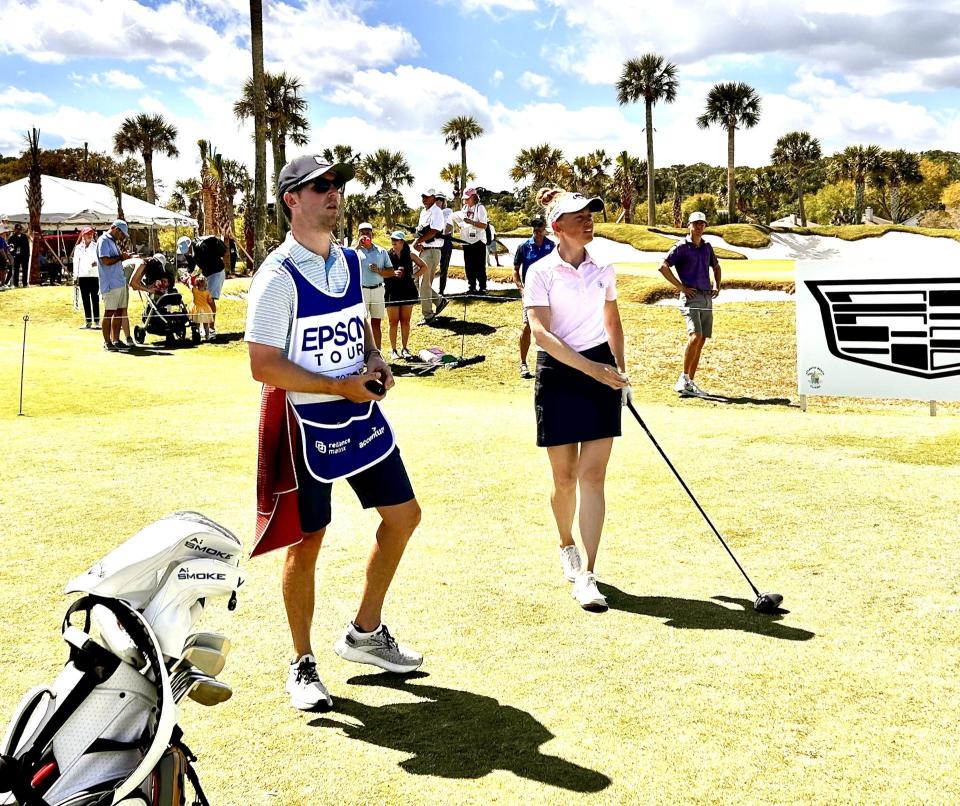 Jessica Porvasnik (right) discusses strategy with caddie Sam Geise on the 10th tee during the final round of the Epson Tour's Atlantic Beach Classic on March 23 at the Atlantic Beach Country Club.