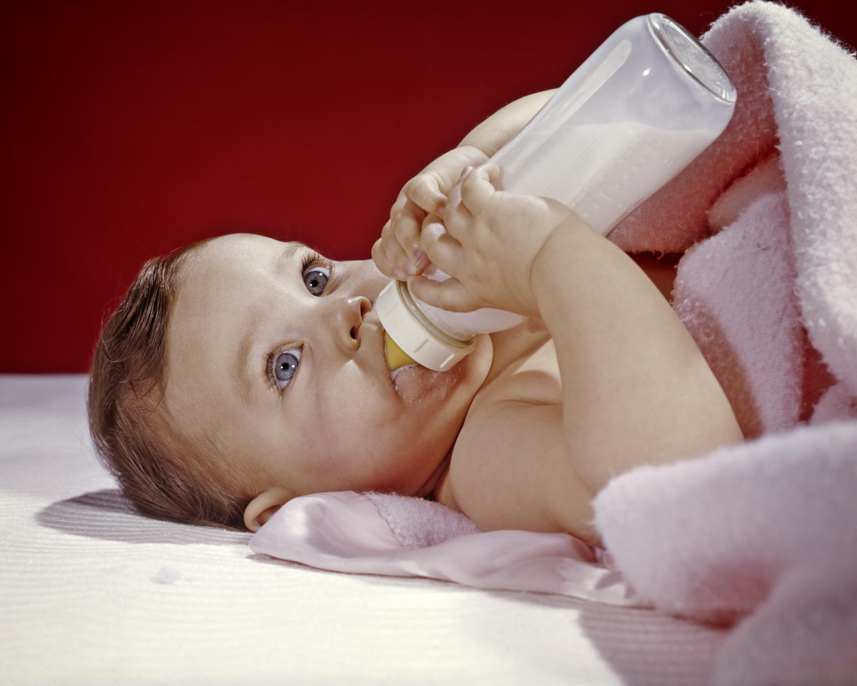 A baby girl drinks from a bottle in the 1960s. Formula feeding became increasingly popular in the U.S. after World War II. (Photo: H. Armstrong Roberts/ClassicStock/Getty Images)