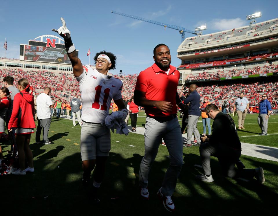 Ohio State Buckeyes wide receiver Jaxon Smith-Njigba (11) points to Ohio State fans in the stands as he runs off the field following Saturday's NCAA Division I football game against the Nebraska Cornhuskers at Memorial Stadium in Lincoln, Neb., on November 6, 2021. Ohio State won the game 26-17.