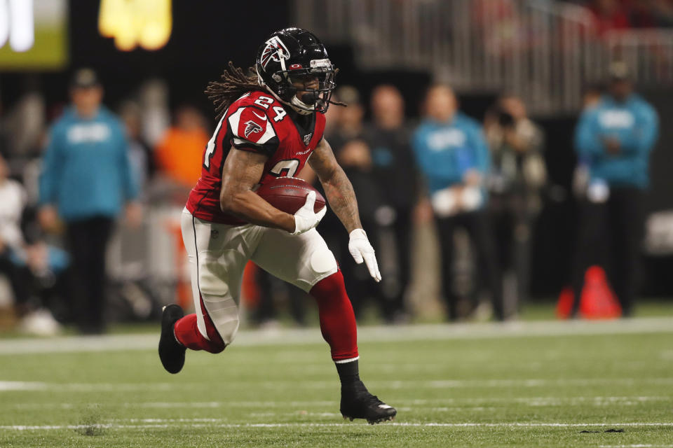 FILE - In this Dec. 22, 2019, file photo, Atlanta Falcons running back Devonta Freeman (24) runs against the Jacksonville Jaguars during the first half of an NFL football game in Atlanta. Two-time Pro Bowl halfback Devonta Freeman has signed with the New York Giants. The Giants announced the signing of Freeman on Wednesday, Sept. 23, 2020, a day after 2018 NFL Offensive Rookie of the Year Saquon Barkley was placed on injured reserve with a torn anterior cruciate ligament in his right knee. (AP Photo/John Bazemore, File)