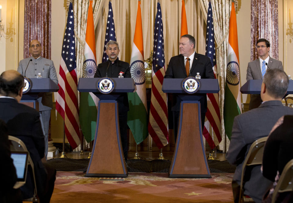 Secretary of State Mike Pompeo, second from right, and Secretary of Defense Mark Esper, right, accompanied by Indian External Affairs Minister Dr. S. Jaishankar, second from left, and Defense Minister Shri Rajnath Singh, left, during a news conference after a bilateral meeting at the Department of State in Washington, Wednesday, Dec.18, 2019. (AP Photo/Jose Luis Magana)