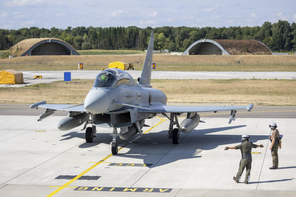 A German Eurofighter is ready for takeoff at Neuburg Air Base in Neuburg An Der Donau, Germany, Monday Aug. 15, 2022. A group of German air force fighter jets neared Singapore on Tuesday, Aug. 16, 2022, in a marathon bid to fly them some 12,800 kilometers (8,000 miles) from their home base to Southeast Asia in just 24 hours. (Daniel Karmann/dpa via AP)