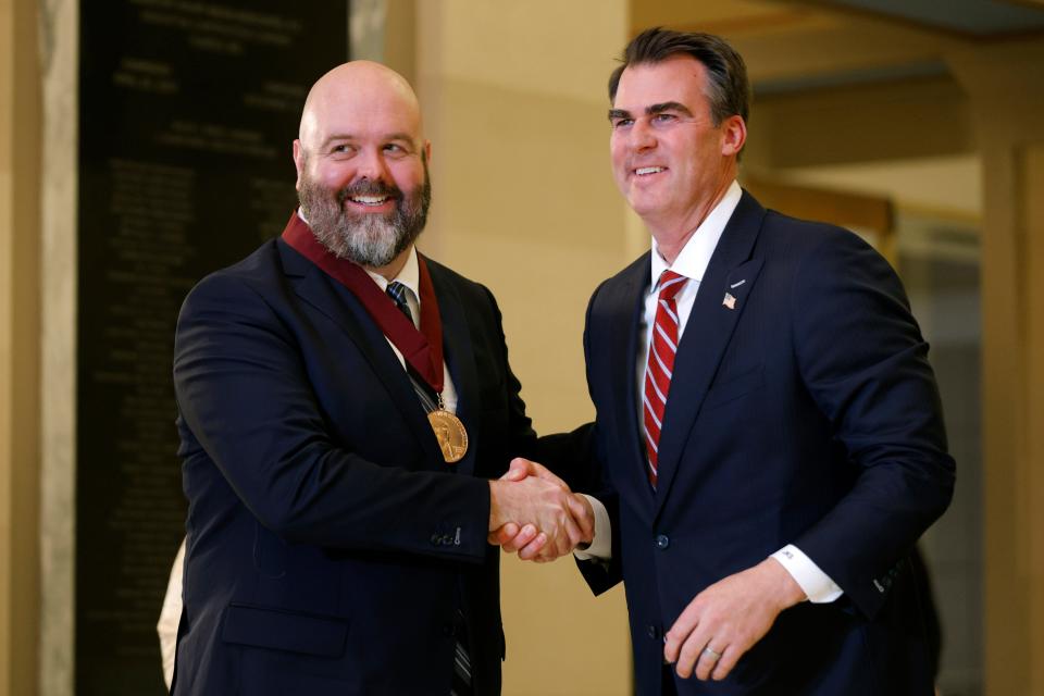 Ryan LaCroix is given the Bill Crawford Memorial Media in the Arts Award by Gov. Kevin Stitt on Tuesday, Jan. 30, 2024, during the 45th Annual Governor's Arts Awards at the state Capitol in Oklahoma City.