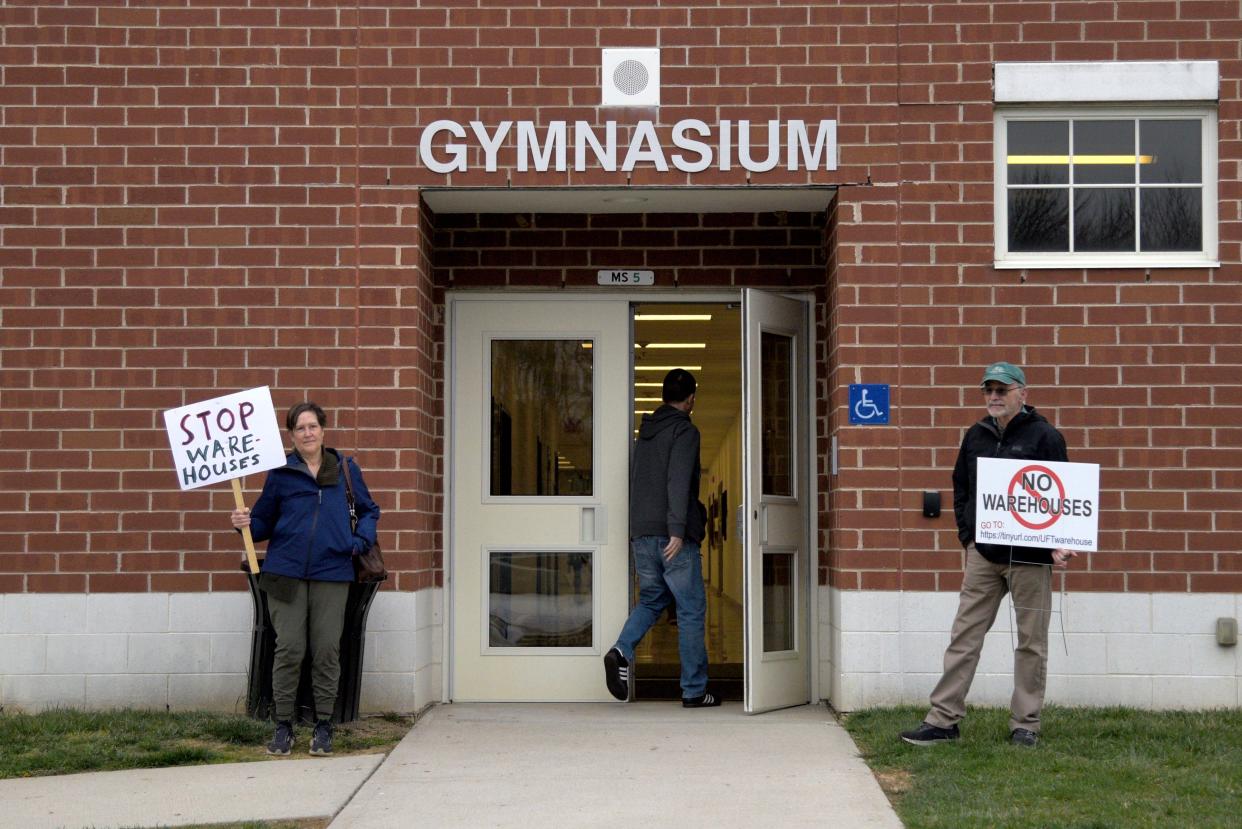 Residents protesting the warehouse proposal outside Stone Brook Middle School on Tuesday, March 26, 2024 in Upper Freehold, New Jersey.