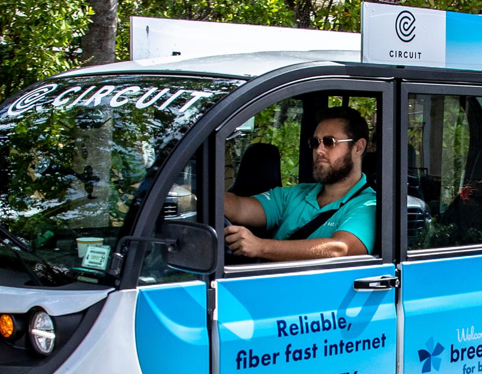 Trevor Schultz, a driver for Circuit, an award-winning 100% complimentary electric shuttle, leaves the Palm Beach Publix on his way to his next pick up on April 13.