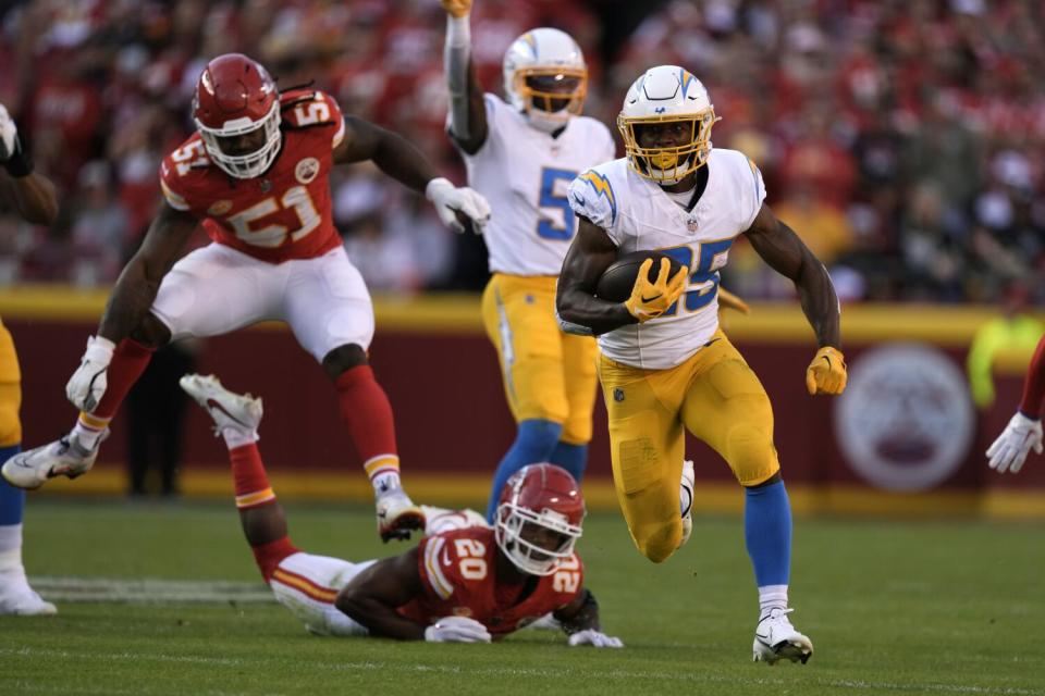 Joshua Kelley runs for a touchdown.