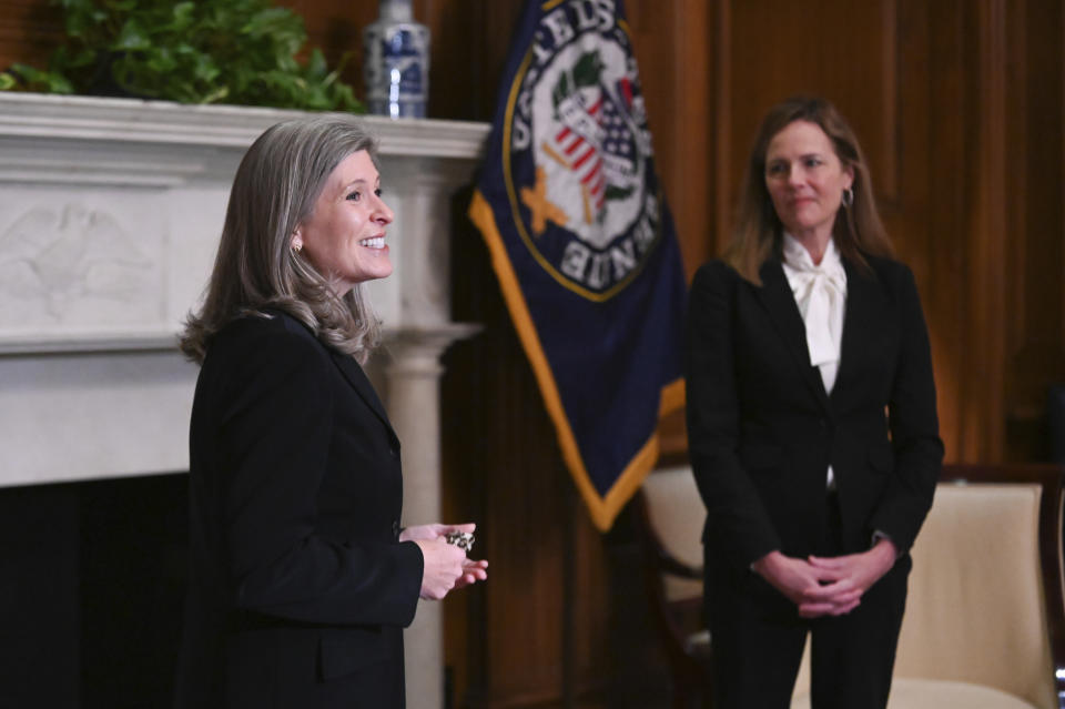 Supreme Court nominee Judge Amy Coney Barrett, meets with Sen. Joni Ernst, R-Iowa, Thursday, Oct. 1, 2020 at the Capitol in Washington. (Erin Scott/Pool via AP)