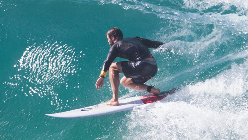 These Hot Photos Of Chris Hemsworth Surfing Will Make Your Friday