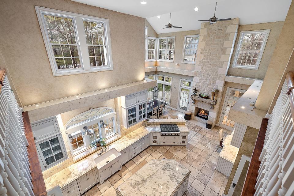 Two-story kitchen in a home once featured in Better Homes & Gardens, 920 Pine Needle Trail in Oakland Township.