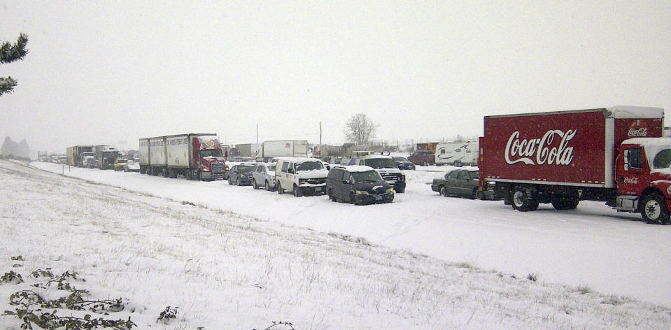 This image provided by the Oregon Department of Transportation shows a traffic jam Thursday Feb. 6, 2014 near Albany, Ore. As many of 25 vehicles collided in clusters in southbound lanes near Albany, the state Department of Transportation said. A detour was then blocked by another crash. This storm is expected to drop snow throughout the state, with as many as nine inches accumulating in the central Willamette Valley.(AP Photo/ Oregon Department of Transportation)