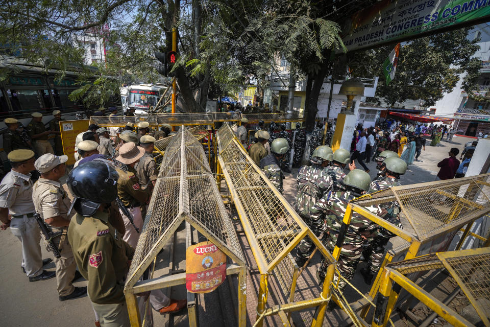 Police erect barricades outside the Assam Pradesh Congress party office to prevent a protest against the Citizenship Amendment Act (CAA) in Guwahati, India, Tuesday, March 12, 2024. India has implemented a controversial citizenship law that has been widely criticized for excluding Muslims, a minority community whose concerns have heightened under Prime Minister Narendra Modi’s Hindu nationalist government. The act provides a fast track to naturalization for Hindus, Parsis, Sikhs, Buddhists, Jains and Christians who fled to Hindu-majority India from Afghanistan, Bangladesh and Pakistan before Dec. 31, 2014. (AP Photo/Anupam Nath)
