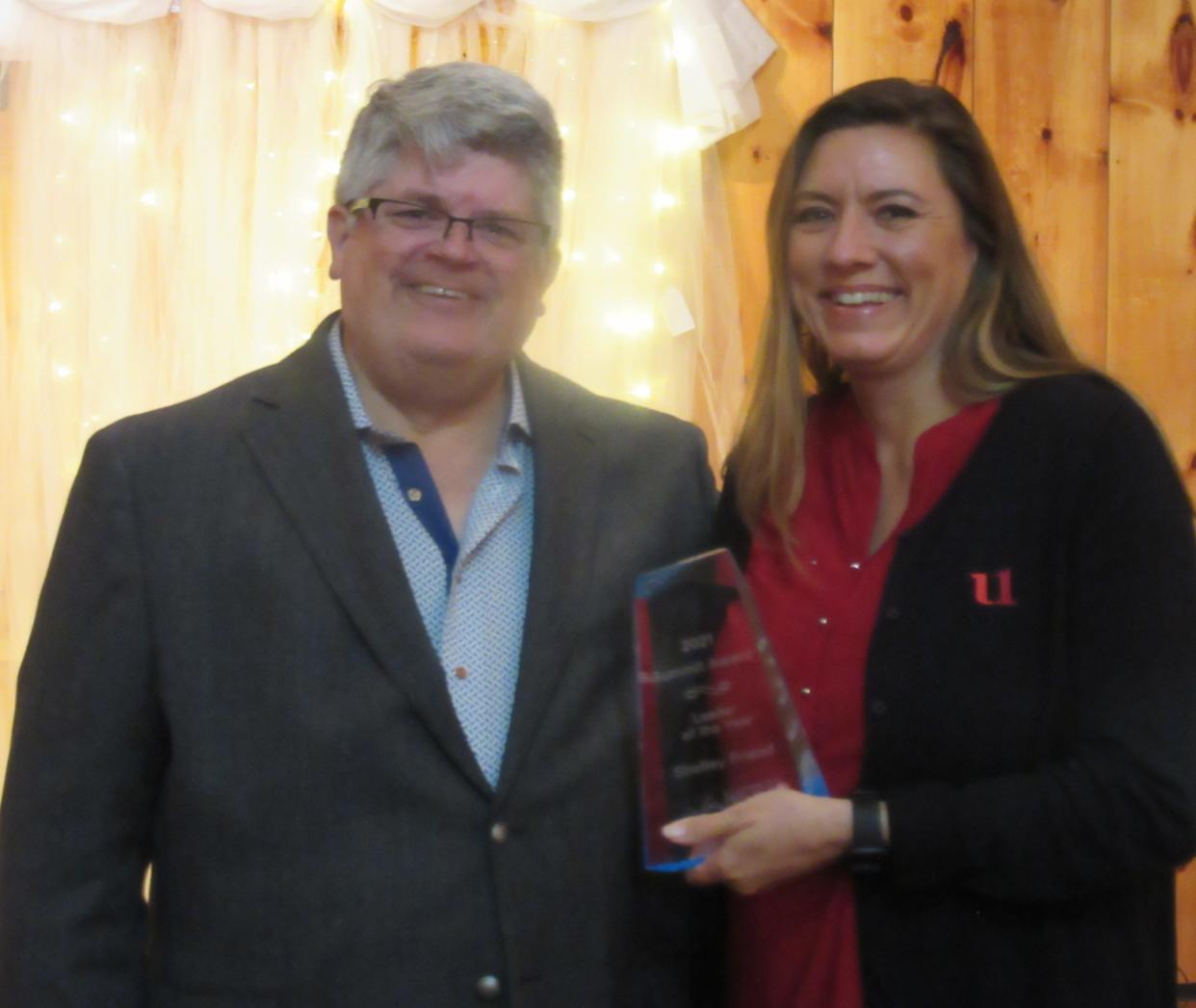 Shelley Friend (right) was recognized as Mineral County’s Leader of the Year during the annual Summit Awards. Shown presenting her award is Chamber of Commerce president Randy Crane.