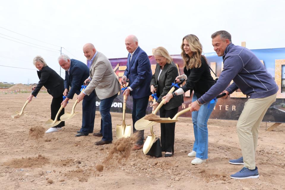 Officials from the city of Peoria, The Pederson Group and the Safeway supermarket chain turn shovels at 83rd Avenue and Happy Valley Road on Wednesday, March 6, to celebrate the construction of The Trailhead, a 903,000-square-foot mixed-use development.