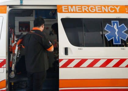 A woman suspected of Zika infection leaves in an ambulance from a clinic, at an area where locally transmitted Zika cases were discovered in Singapore August 31, 2016. REUTERS/Edgar Su