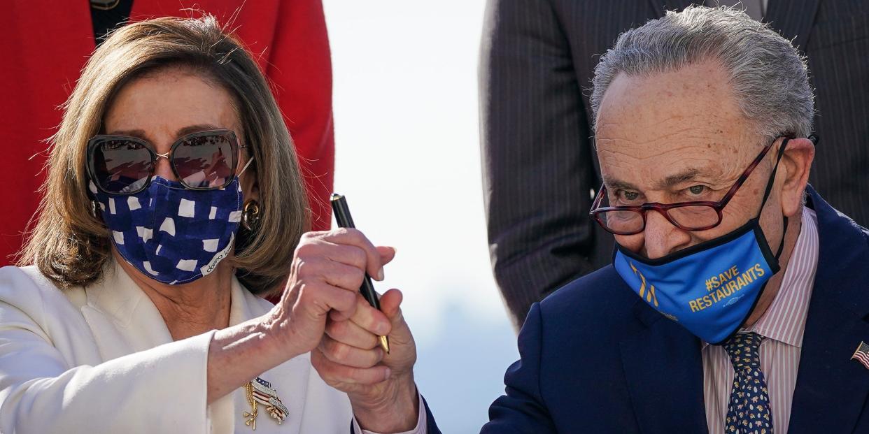 Nancy Pelosi Chuck Schumer holding pen