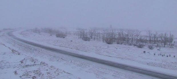 Pictured is Highway 1 near Balgonie on Tuesday morning after snowfall and blowing snow overnight, (Highway Hotline - image credit)