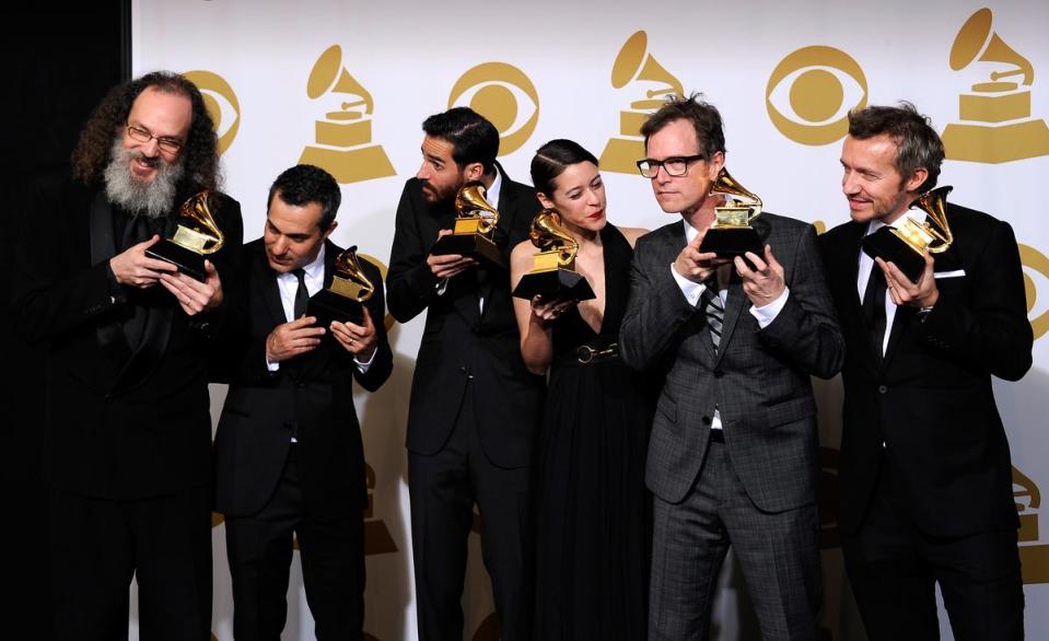 Fraser T Smith (right) with Dan Wilson, Beatriz Artola, Philip Allen, Greg Fidelman and Andrew Scheps with their Album of the Year Grammys for Adele’s ‘21’ (Getty)