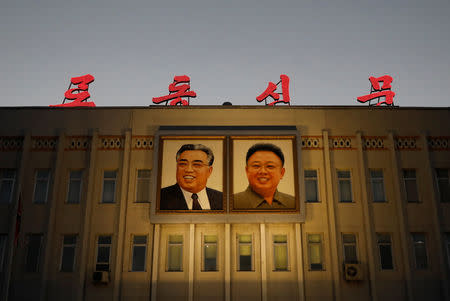 Portraits of late North Korean leaders Kim Il Sung and Kim Jong Il are seen on the facade of a government building in Pyongyang, North Korea, September 10, 2018. REUTERS/Danish Siddiqui