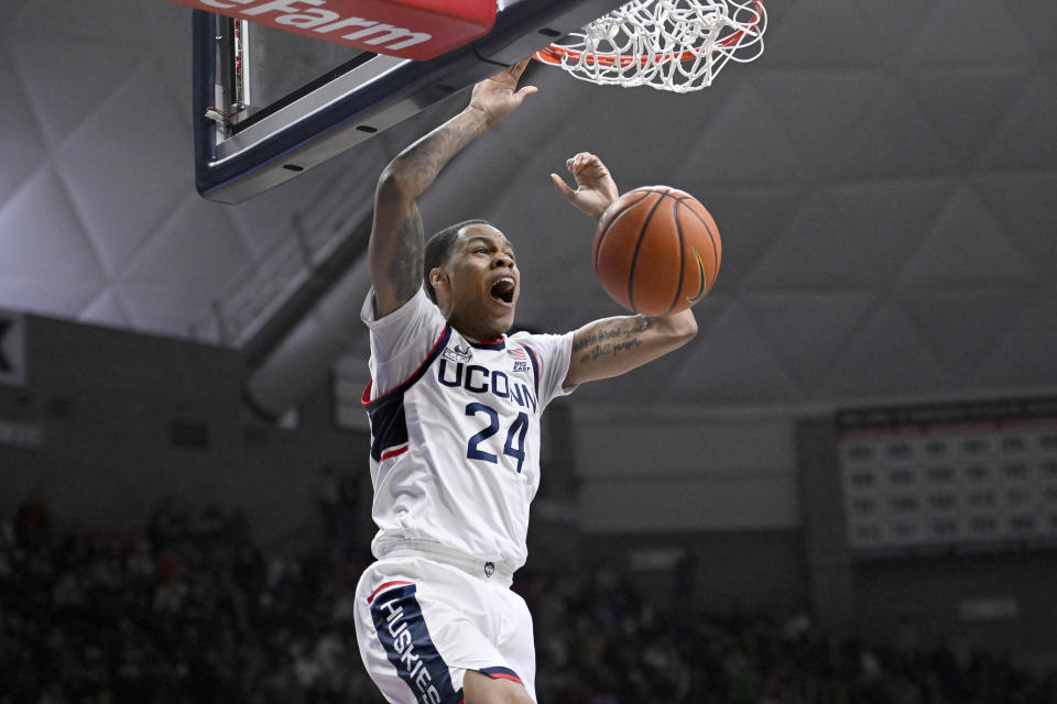 Connecticut's Jordan Hawkins dunks during the second half of the team's NCAA college basketball game against UNC Wilmington, Friday, Nov. 18, 2022, in Storrs, Conn. (AP Photo/Jessica Hill)