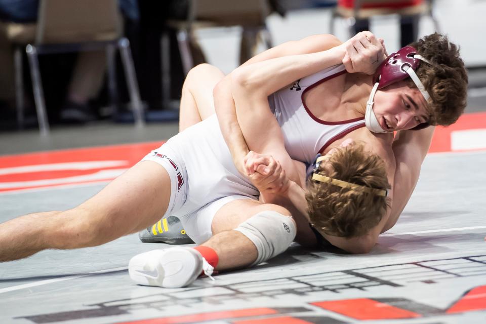 Faith Christian Academy's Gauge Botero prepares to pin Bald Eagle Area's Lucas Fye at 2:51 during a 113-pound quarterfinal bout at the PIAA Class 2A Wrestling Championships at the Giant Center on Friday, March 11, 2022, in Derry Township.