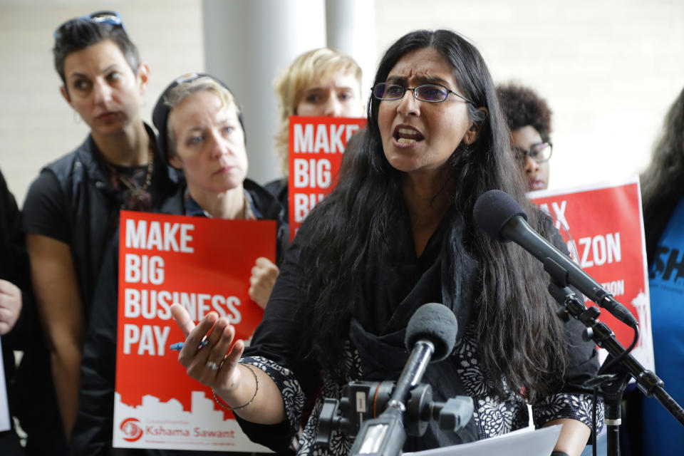 FILE - In this June 12, 2018, file photo, Seattle City Council member Kshama Sawant speaks at City Hall in Seattle. Seven of the nine Seattle City Council seats are up for grabs in next month's election, where retail giant Amazon has made unprecedented donations totaling $1.5 million to a political action committee that's supporting a slate of candidates perceived to be friendlier to business. Among the company's top targets is Sawant, a fierce critic of Amazon, who is running against Egan Orion in the District 3 race. (AP Photo/Ted S. Warren, File)