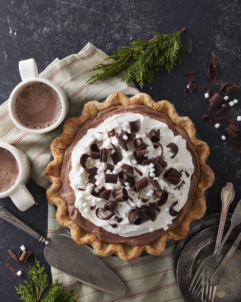 hot chocolate icebox pie topped with whipped cream chocolate curls and mini marshmallows