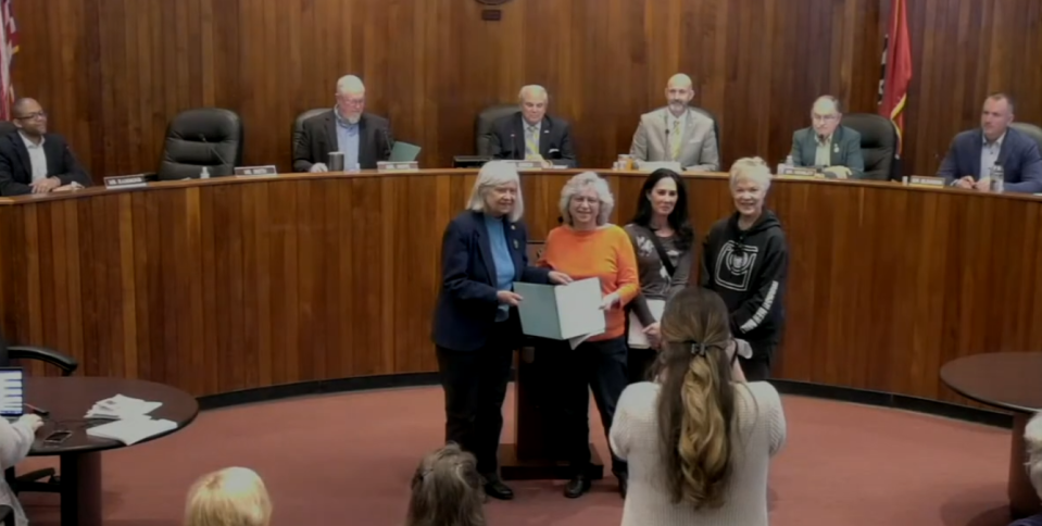 Oak Ridge City Council member Ellen Smith presents the mayor's proclamation of Holocaust Remembrance Day to Ronnie Bogard with Robin Schiek and Jinx Watson on April 10.