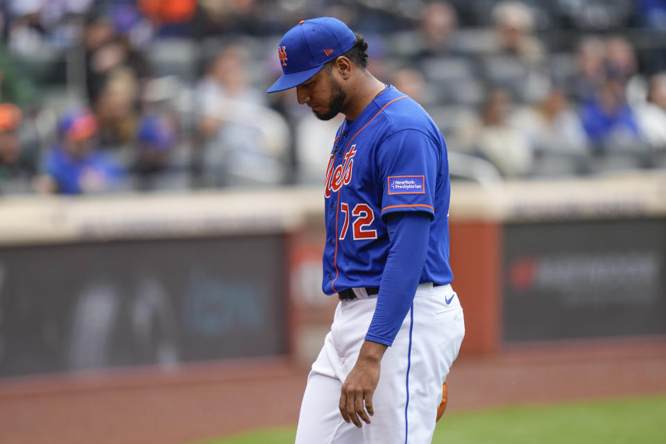 New York Mets pitcher Denyi Reyes leaves the game during the second inning of the first baseball game of a doubleheader against the Atlanta Braves at Citi Field, Monday, May 1, 2023, in New York. (AP Photo/Seth Wenig)