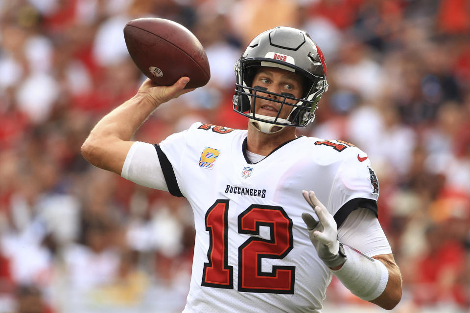 TAMPA, FLORIDA - OCTOBER 24: Tom Brady #12 of the Tampa Bay Buccaneers throws a pass in the first quarter against the Chicago Bears in the game at Raymond James Stadium on October 24, 2021 in Tampa, Florida. (Photo by Mike Ehrmann/Getty Images)