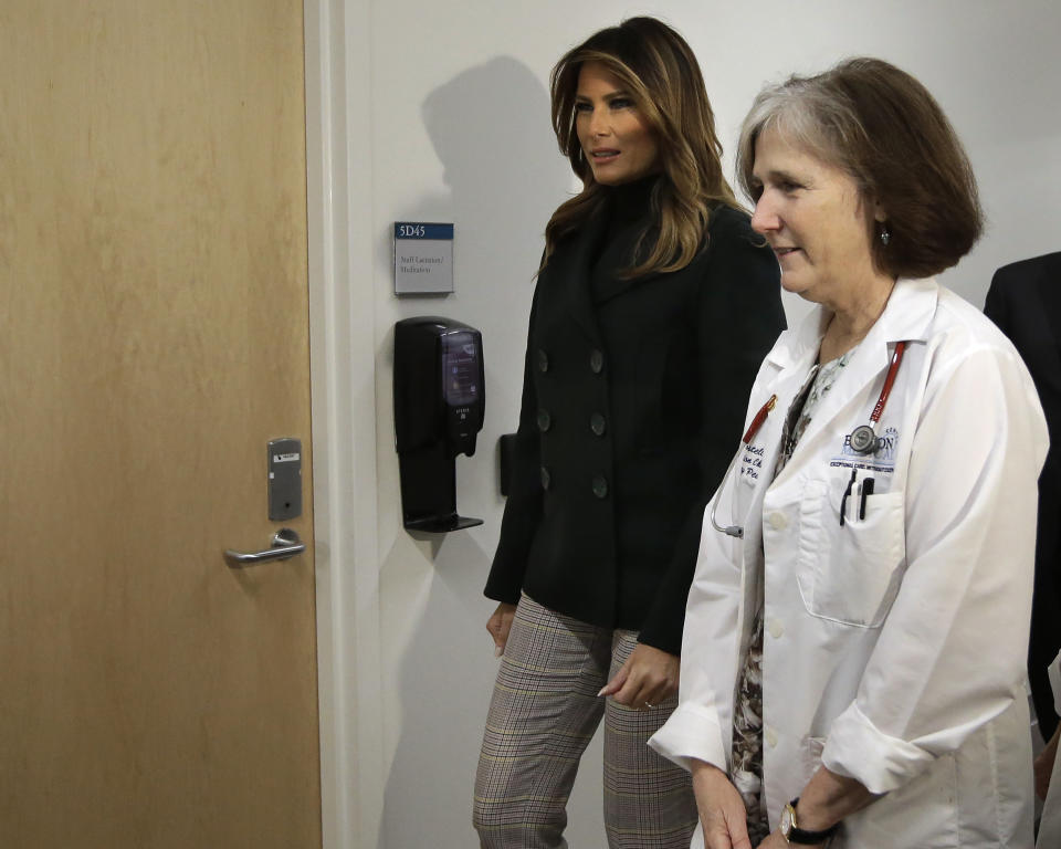 First lady Melania Trump, left, walks with pediatrician Eileen Costello, right, during a visit to Boston Medical Center, in Boston, Wednesday, Nov. 6, 2019. The visit, part of the first lady's "Be Best" initiative, included the hospital's pediatric intensive care unit. (AP Photo/Steven Senne, Pool)