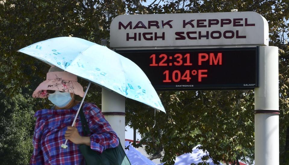 Excessively hot days are occurring more regularly during the school year than in previous decades. <a href="https://www.gettyimages.com/detail/news-photo/the-temperature-reads-104f-degrees-at-mark-keppel-high-news-photo/1228811840" rel="nofollow noopener" target="_blank" data-ylk="slk:Frederic J. Brown/AFP via Getty Images;elm:context_link;itc:0;sec:content-canvas" class="link ">Frederic J. Brown/AFP via Getty Images</a>