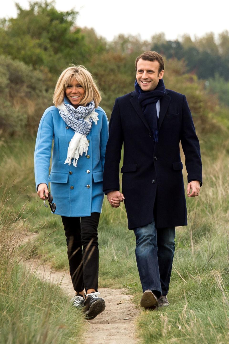 <p>In a bright blue jacket and white printed scarf with black skinny jeans and sneakers while on a walk with her husband in Le Touquet, France.</p>
