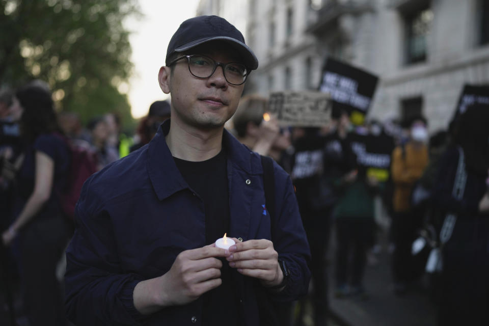 FILE - Hong Kong activist Nathan Law attends a candlelight vigil outside the Chinese embassy in London on June 4, 2023, to mark the anniversary of China's bloody 1989 crackdown on pro-democracy protests in Beijing's Tiananmen Square. Hong Kong's leader said Tuesday, July 4, that eight pro-democracy activists who now live in the United States, Britain, Canada and Australia will be pursued for life for alleged national security offenses, dismissing criticism that the move to have them arrested was a dangerous precedent. (AP Photo/Kin Cheung, File)
