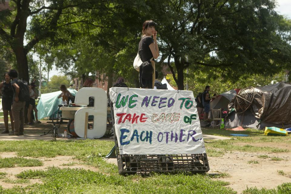 An encampment supporter waits for Toronto police to clear Lamport Stadium Park homeless encampment in Toronto in July 2021. THE CANADIAN PRESS/Chris Young