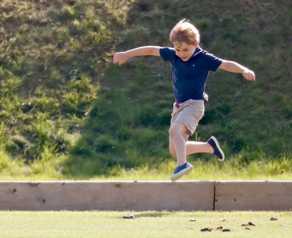 <p> Max Mumby/Indigo/Getty</p> Prince George plays at a polo match in Gloucester in 2018.