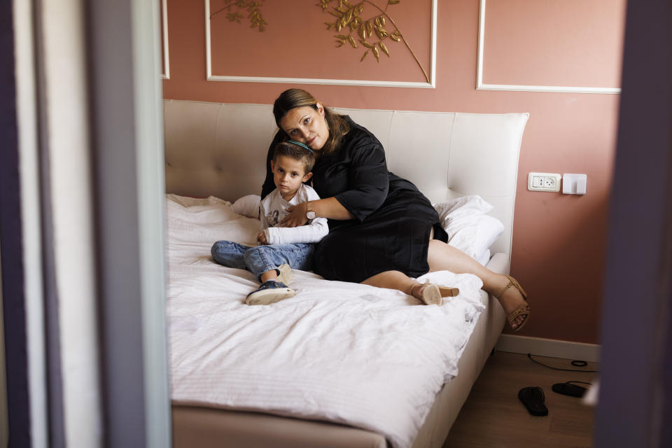 Amichay with her son in their home in Modi'in-Maccabim-Re'ut, Israel. 