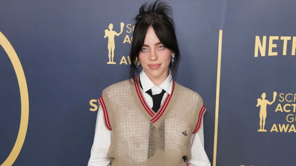 Billie Eilish in a Vivienne Westwood knit and loose suiting. - Jordan Strauss/Invision/AP