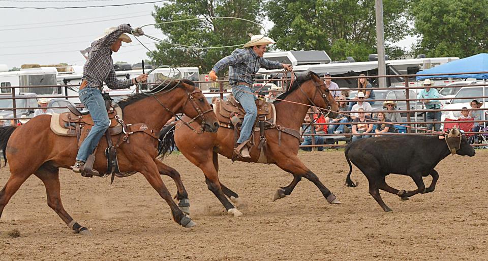 Tyan Johnson of Sisseton (left) and Chase Frericks of Frankfort compete in team roping during the Watertown East Region High School Rodeo at Derby Downs on Saturday, June 10, 2023.