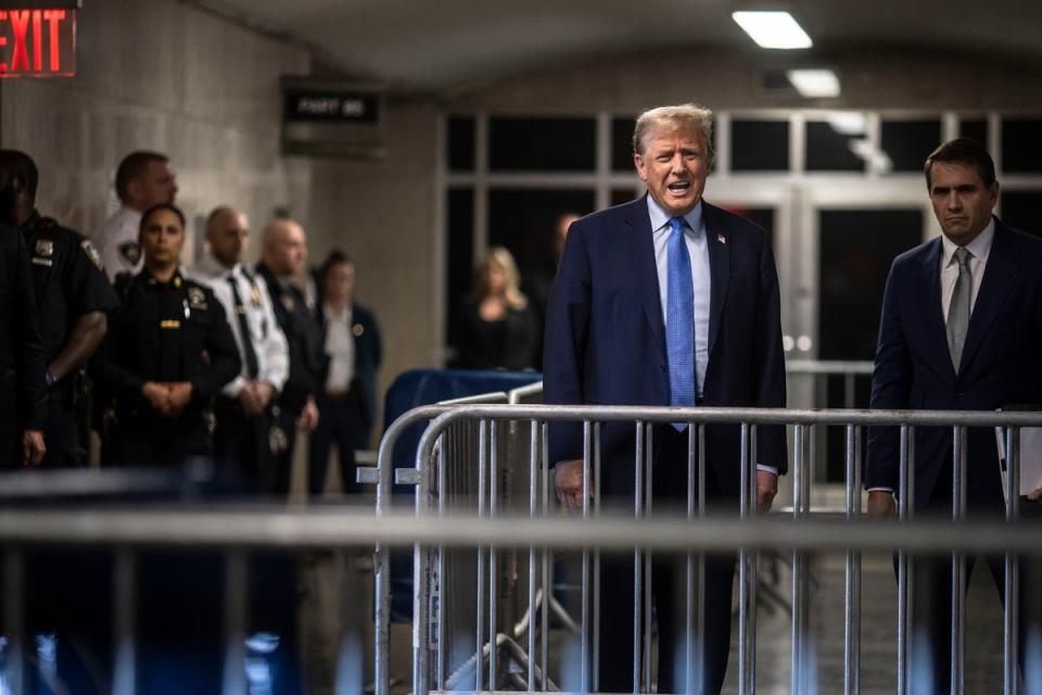 Trump speaks to reporters after leaving a Manhattan courtroom on 26 April (EPA)