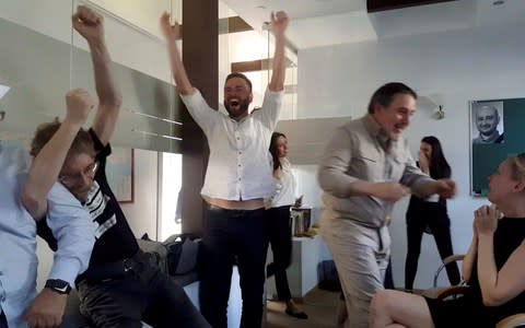 ATR journalists react on Russian journalist Arkady Babchenko's appearance during a news conference, in the ATR newsroom in Kiev - Credit: Reuters