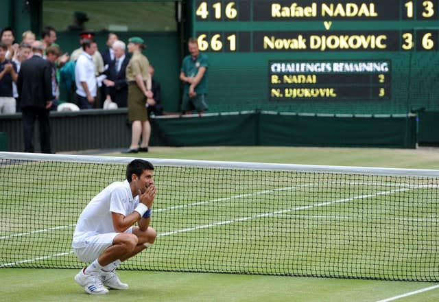 Novak Djokovic celebrates his win over Rafael Nadal at Wimbledon 2011