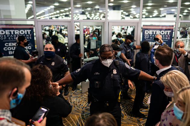 Election challengers demand to enter to observe absentee ballot counting after the 2020 general election in Detroit on Nov. 4. One of the Democratic measures would provide a minimum distance between a poll observer and any voter or ballot. (Photo: Salwan Georges/The Washington Post via Getty Images)