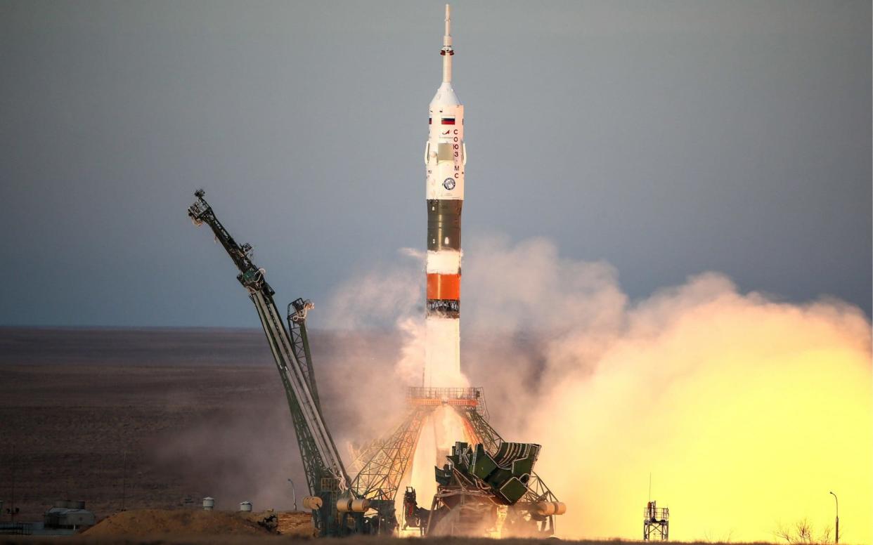 A Soyuz rocket with Russian, American and Canadian astronauts on board begins its launch on Monday - TASS / Barcroft Media