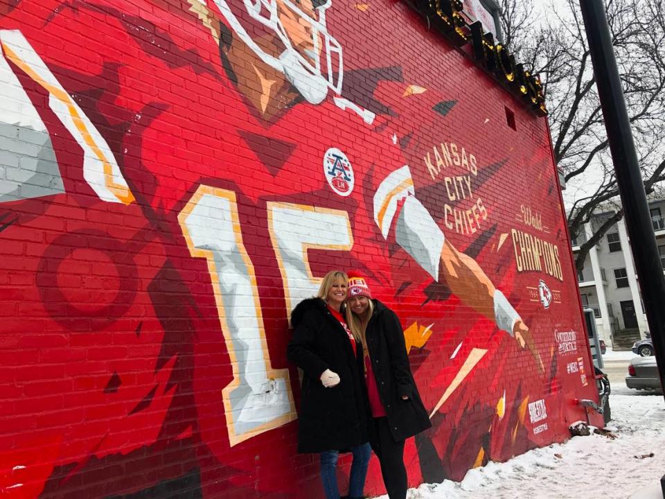 Madison Usher, 23, snaps a photo with her mother, Jane Usher, in front of the Chiefs mural on the Westport Ale House ahead of the 2021 Super Bowl game. Feb. 7, 2021.