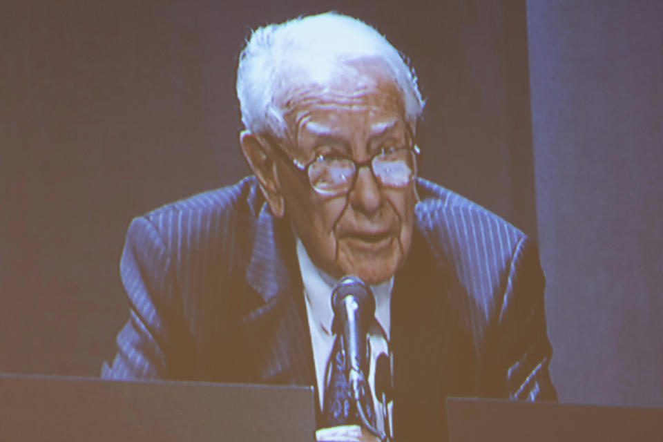 Shareholders watch Warren Buffett from the overflow room during the Berkshire Hathaway annual meeting on Saturday, May 6, 2023, in Omaha, Neb. (AP Photo/Rebecca S. Gratz)