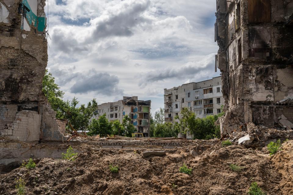 Investigators examine the destruction in Borodyanka, Ukraine.