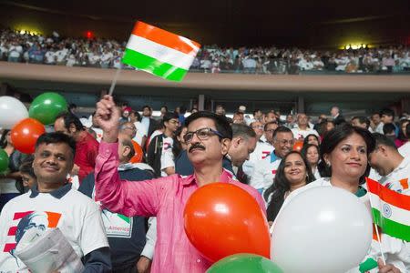 Audience members wave Indian flags and hold balloons during an event with India's Prime Minister Narendra Modi at Madison Square Garden in New York, during his visit to the United States, September 28, 2014. REUTERS/Lucas Jackson