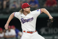 Texas Rangers starting pitcher Jon Gray (22) delivers a pitch to the St. Louis Cardinals during the first inning of a baseball game, Wednesday, June 7, 2023, in Arlington, Texas. (AP Photo/Jim Cowsert)