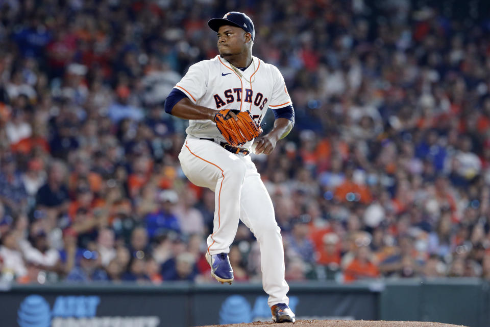 Houston Astros starting pitcher Framber Valdez winds up during the first inning of the team's baseball game against the Texas Rangers on Saturday, July 24, 2021, in Houston. (AP Photo/Michael Wyke)